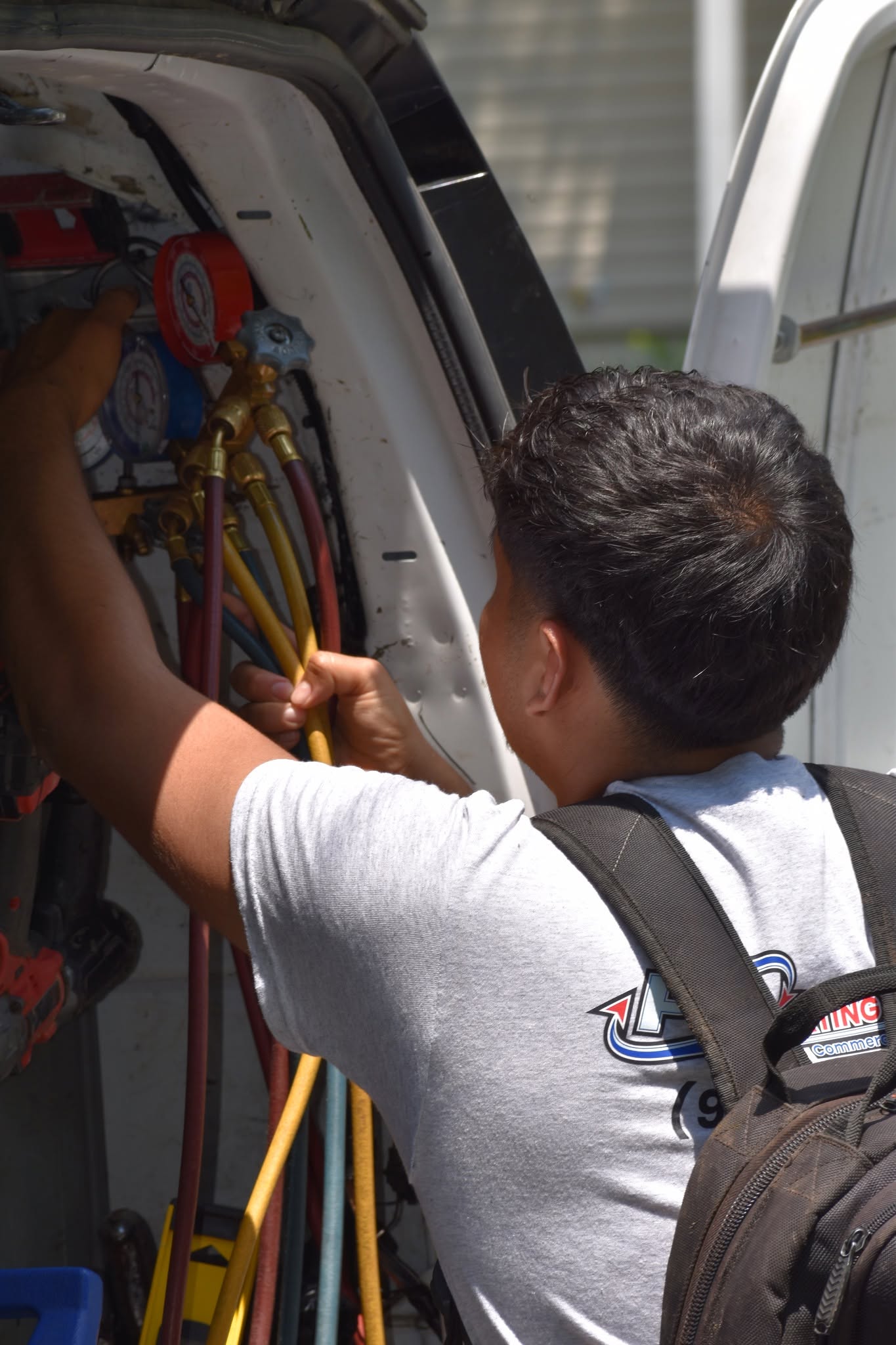 Refrigerant gauges and tools organized in a PZ service van